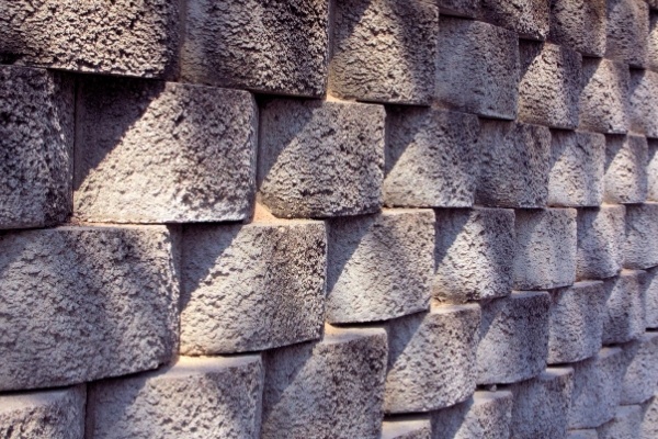 A close up photo of a retaining wall meant to stop soil erosion. 