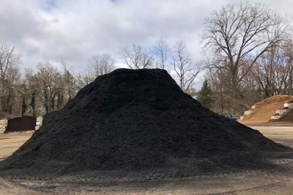 Large pile of mulch at a landscape supply company.