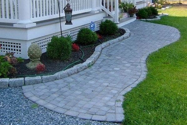 Gravel to grey pavers on front walkway.